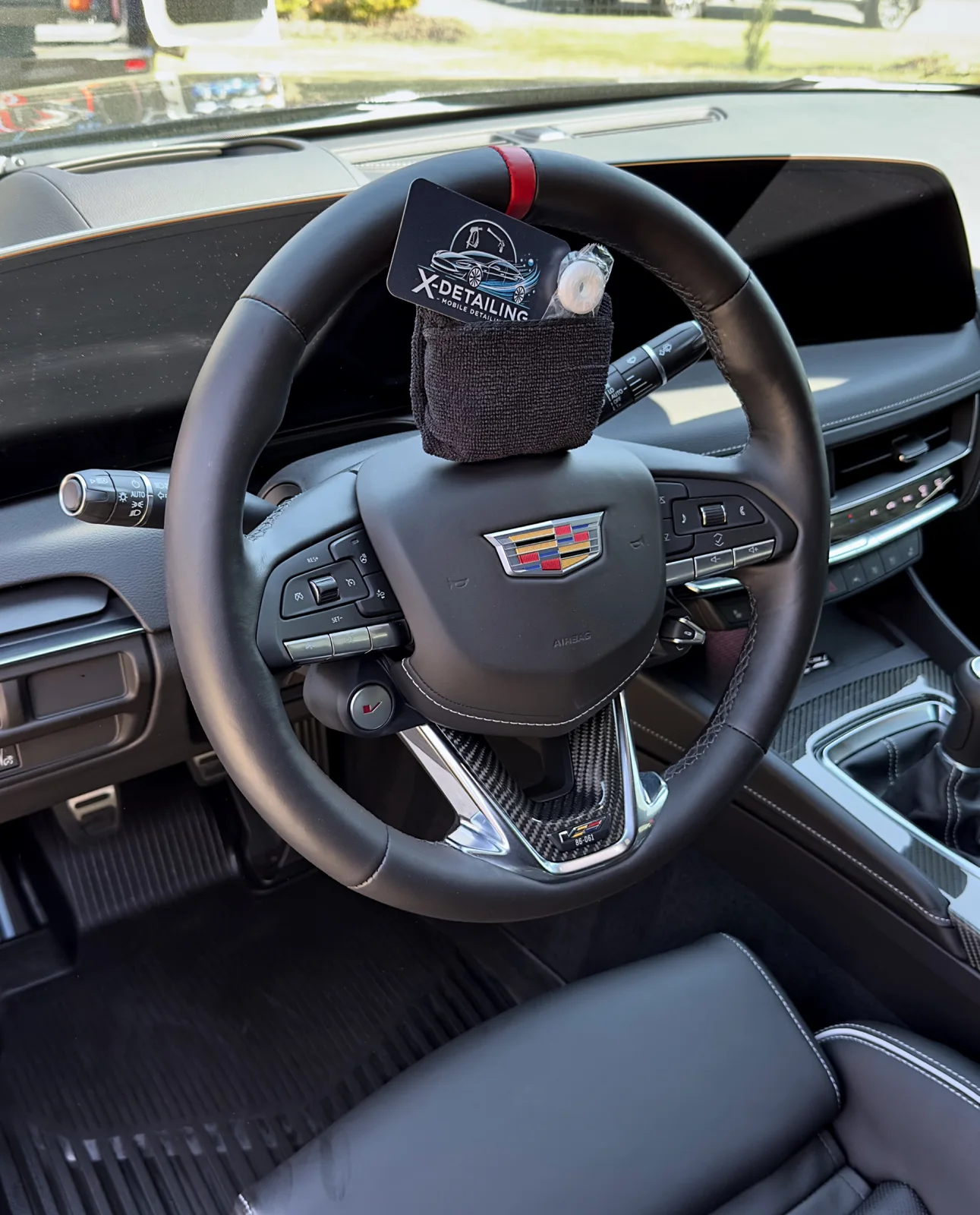 Cadillac CT5-V Blackwing finished steering wheel and driver cockpit after detailing in Cumming GA